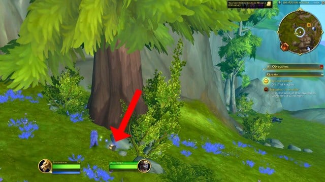 Red arrow pointing to Korgran's lantern under a tree in wow the war within