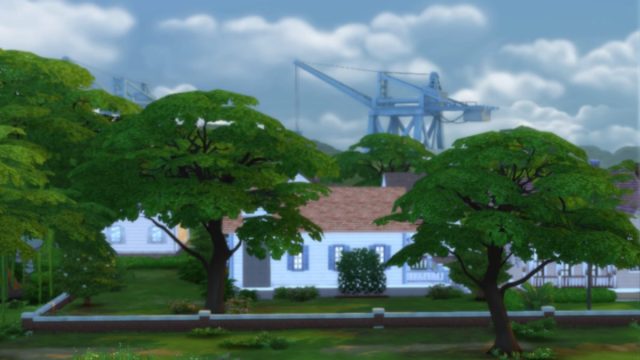 A shot of a house in The Sims 4 neighborhood with trees covering the view of the house and a crane in the background