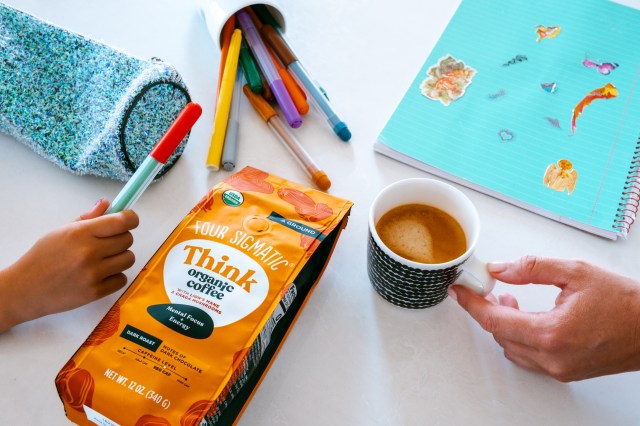 Four Sigmatic's Think and Focus coffee shot with pencils and notebook