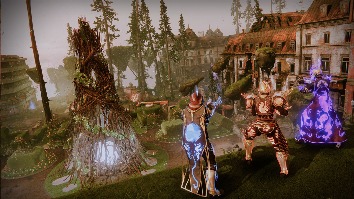 Three guardians wearing Solstice armor stand in front of the EAZ, a destroyed Earth zone, with a large bonfire beneath them.