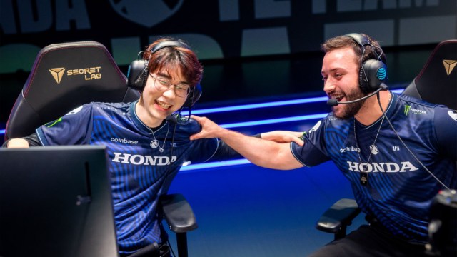 UmTi (left) and APA (right) embrace after Team Liquid win at the LCS Summer Championship.