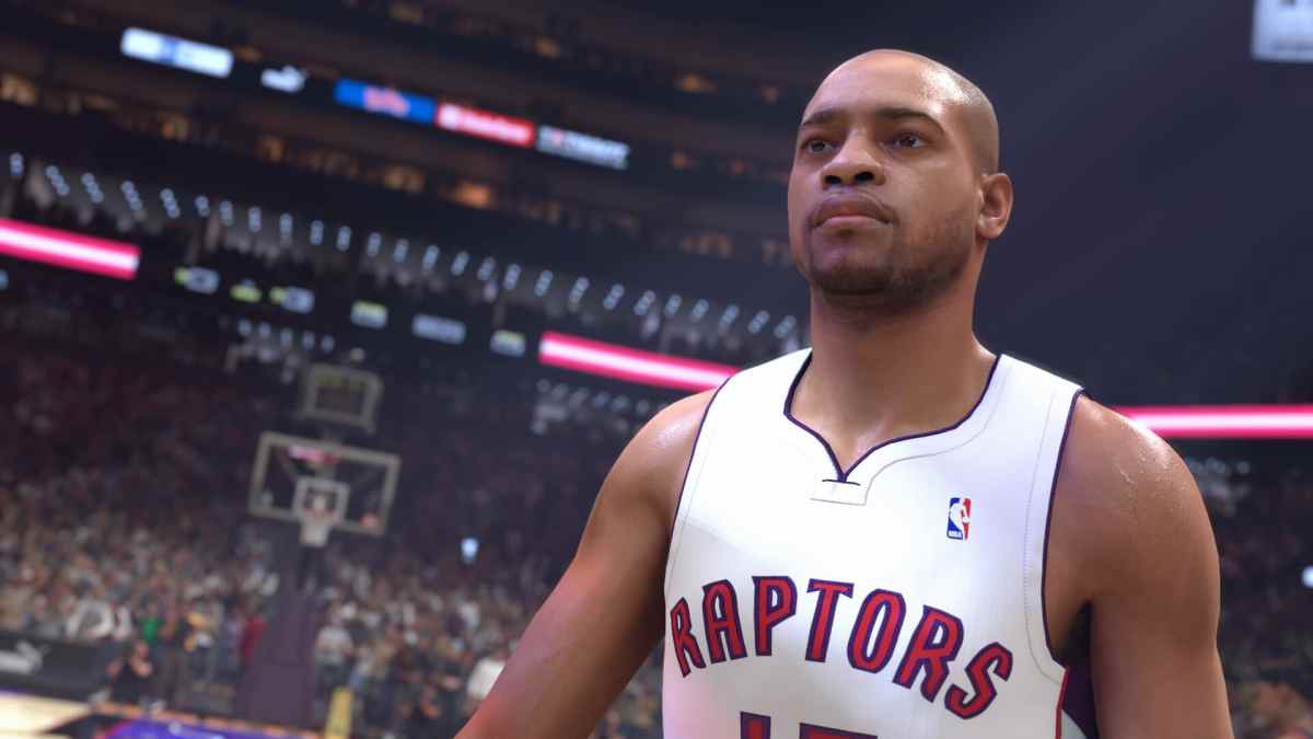 Vince Carter in a Toronto Raptors jersey staring in a basketball arena