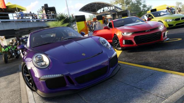 A Porsche and a Corvette side-by-side in The Crew 2.