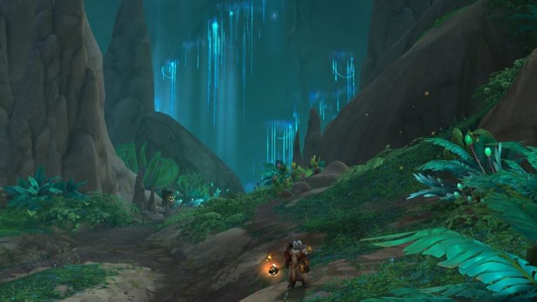 A character standing in The Ringing Deeps Zone in WoW The War Within and holding a torch.