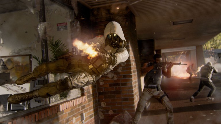 A player dives through a window firing a weapon in Black Ops 6.