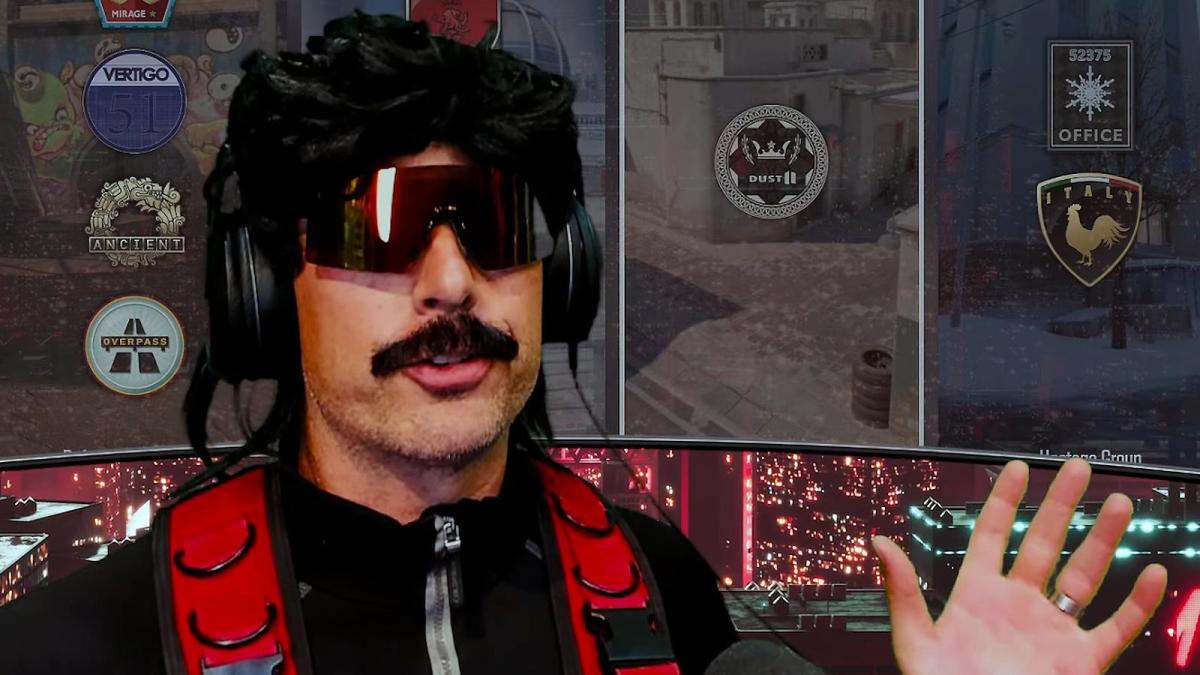 Dr Disrespect speaks to his YouTube fans with his hands raised and a Counter-Strike 2 menu loading in the background.