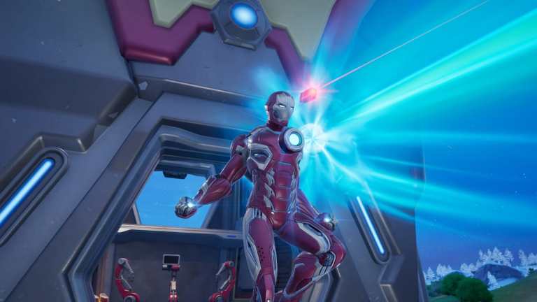 Iron Man using an energy weapon in Fortnite.