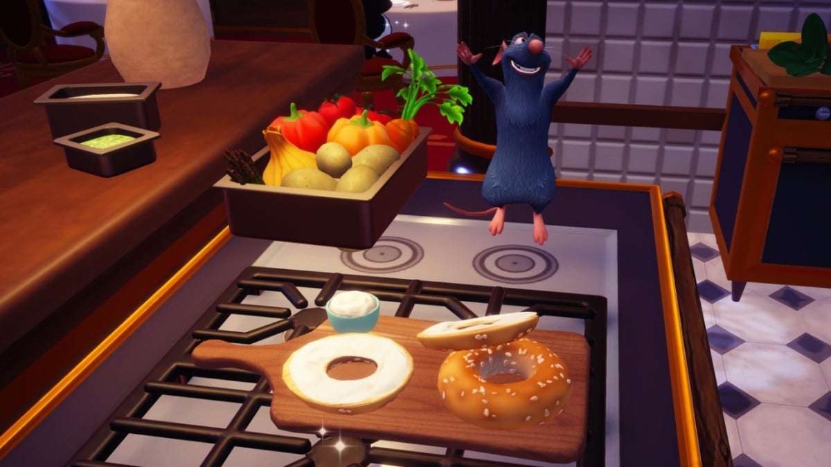 Remy standing on a stove next to a cream cheese bagel in Dreamlight Valley