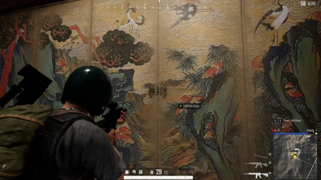 Player aiming a weapon on the painting covering the secret room in Taego