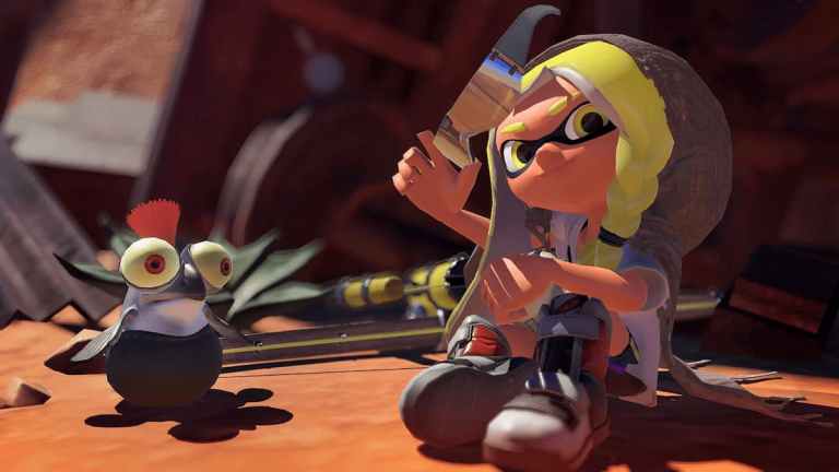 Splatoon character with yellow hair sitting down, holding a pointed object.