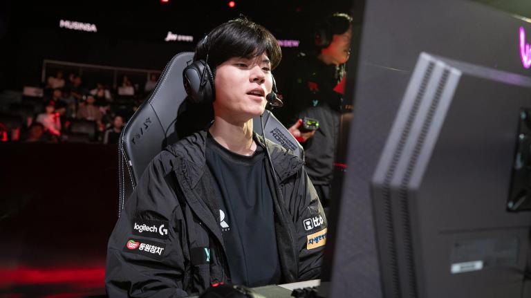 Deft plays League of Legends at an esports computer in front of a packed out LCK Arena