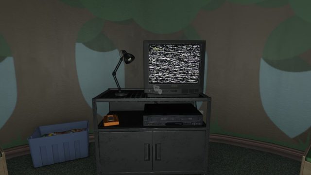 Looking at the Kids Corner television with static on screen and a lamp next to it, with the orange tape in the shelf underneath