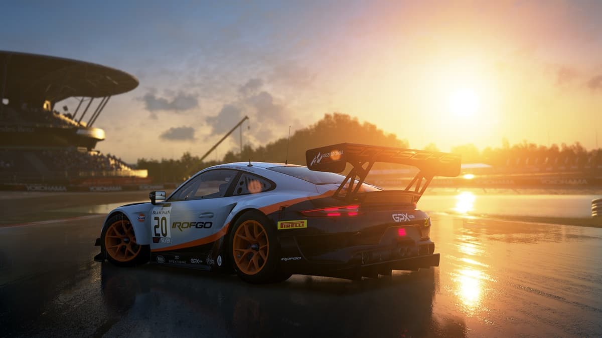 Sports car on the race track in a stadium with a sunset in the background