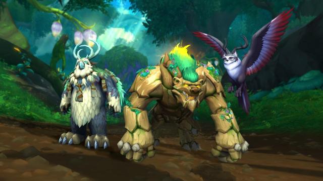 Three Druid forms standing next to each other in World of Warcraft.