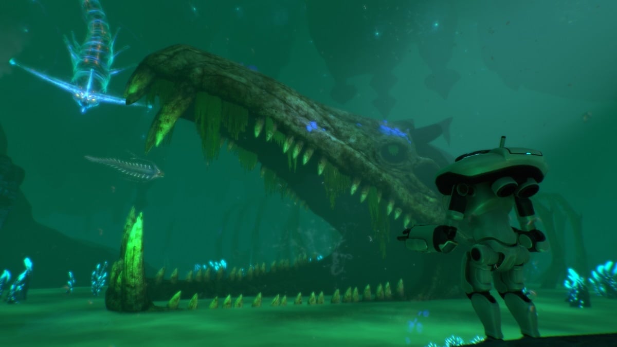 Player character walking the seafloor with the fossil of a sea creature with its jaws wide open in the background