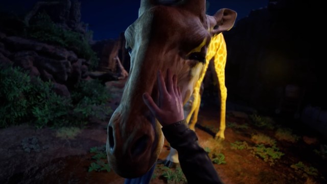 A non-mutant giraffe being petted