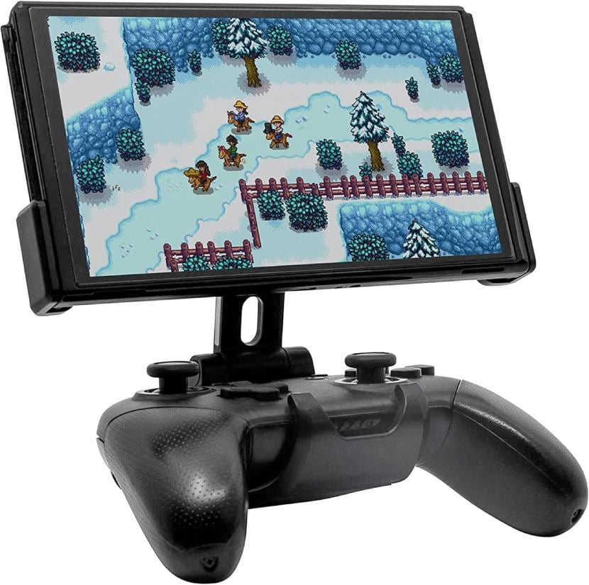 3/4 front view of the Fixture S2 holding a Switch playing Stardew Valley. The Fixture S2 is attached to a Nintendo Switch Pro Controller. More details below.