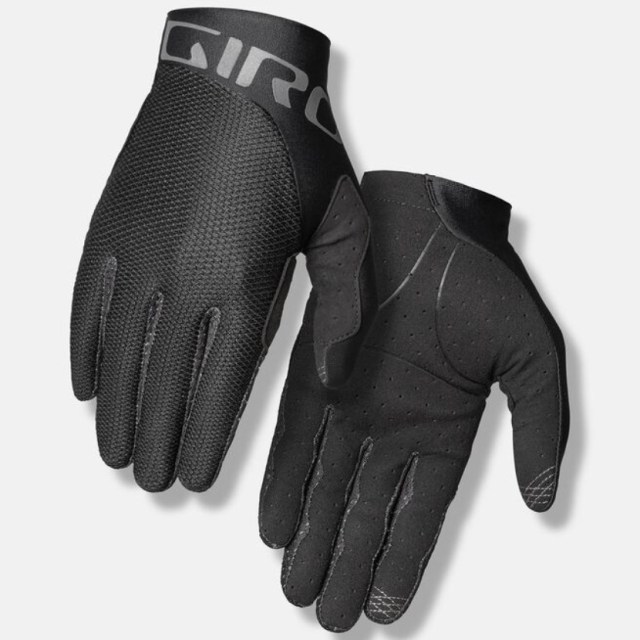 Image of a pair of Giro Trixter Gloves, black cycling gloves with a soft, breathable palm and conductive index and thumb tips. More details below.