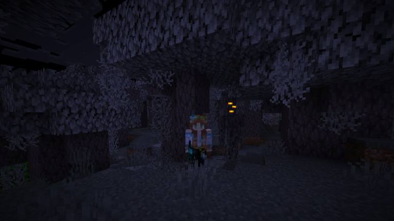 Standing next to the Creaking in a pale garden biome in Minecraft.