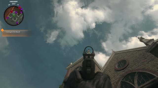 A player aiming a pistol at a helmet on a church roof in Black Ops 6 Zombies.