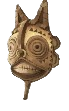 A yellow tribal mask with teeth and spiral eyes. This shows readers what the Curious Mask looks like