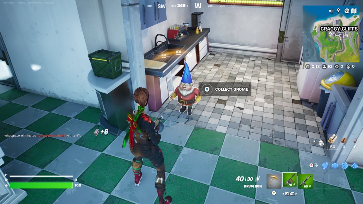 a gnome waits in the kitchen area of a building