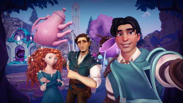 The player taking a picture with Merida and Flynn Rider in Disney Dreamlight Valley.