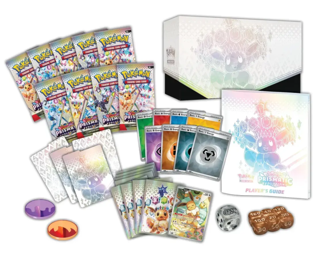 Prismatic Evolutions etb with 9 packsm cards, a book, and a selection of other goodies