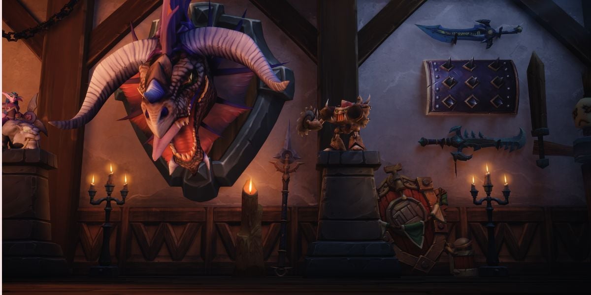 Screenshot of the official player housing reveal from World of Warcraft Midnight stream showing home decorations with a weapon and dragon head.