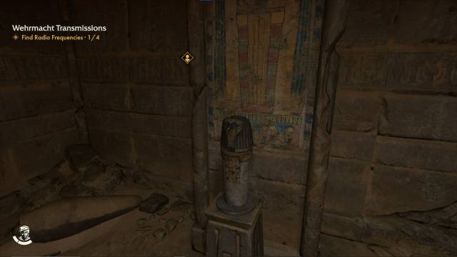 An ancient jar sits on a pedestal in an ancient Egyptian tomb.