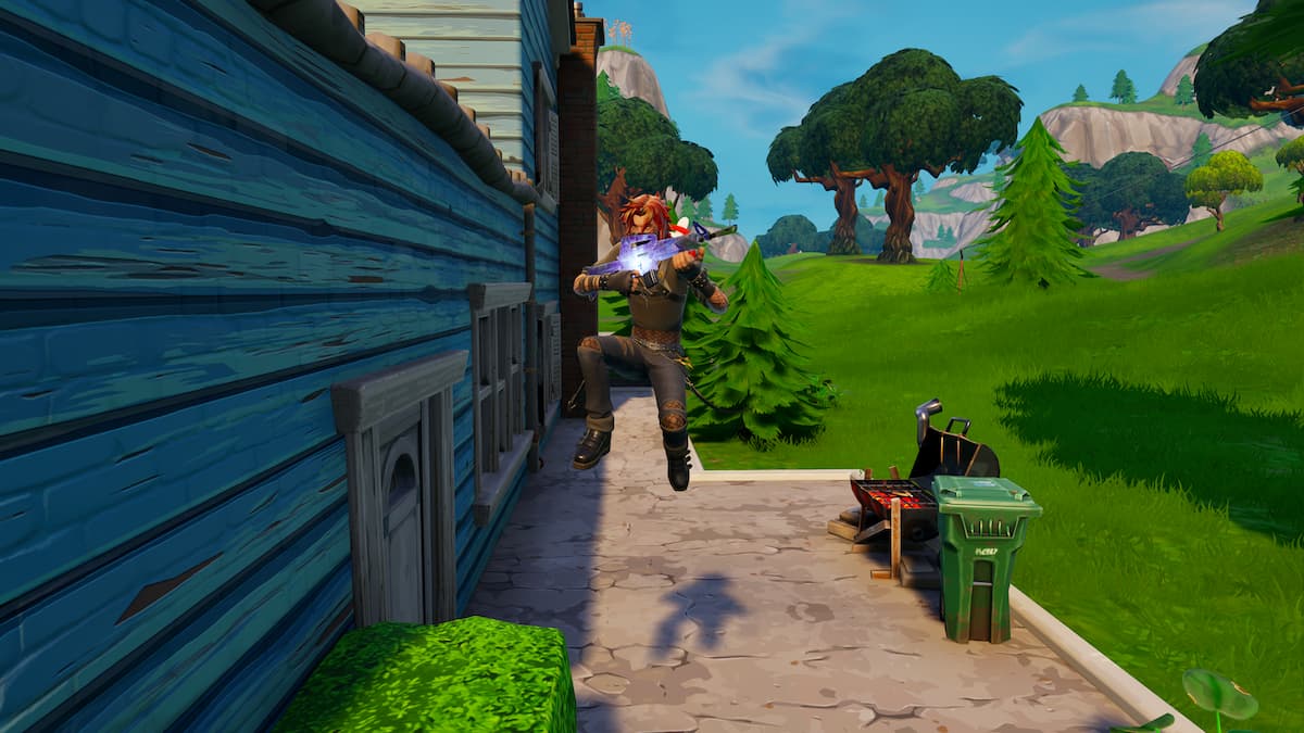 An image of a Fortnite character jumping while holding an assault rifle.