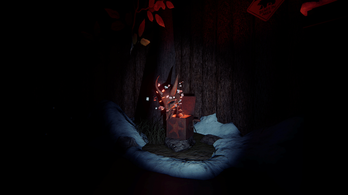 a krampus box on a rock in some snow in a hallway by some dumpsters in phasmophobia.