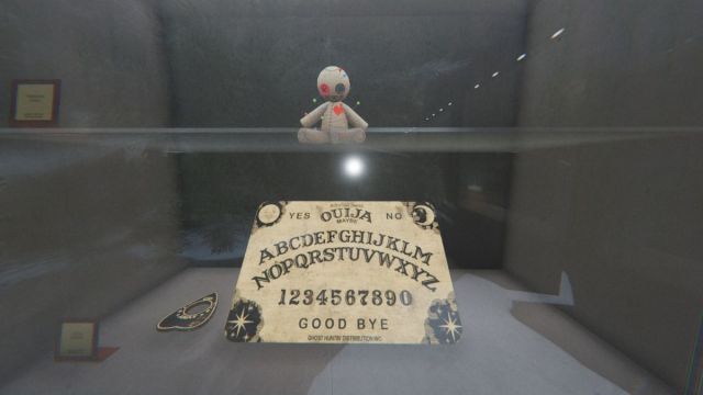 Voodoo Doll and Ouija Board in the lobby display case in Phasmophobia.