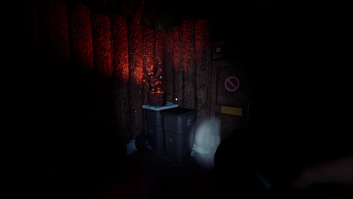 A krampus box on trashcans outside the staff area in phasmophobia. 