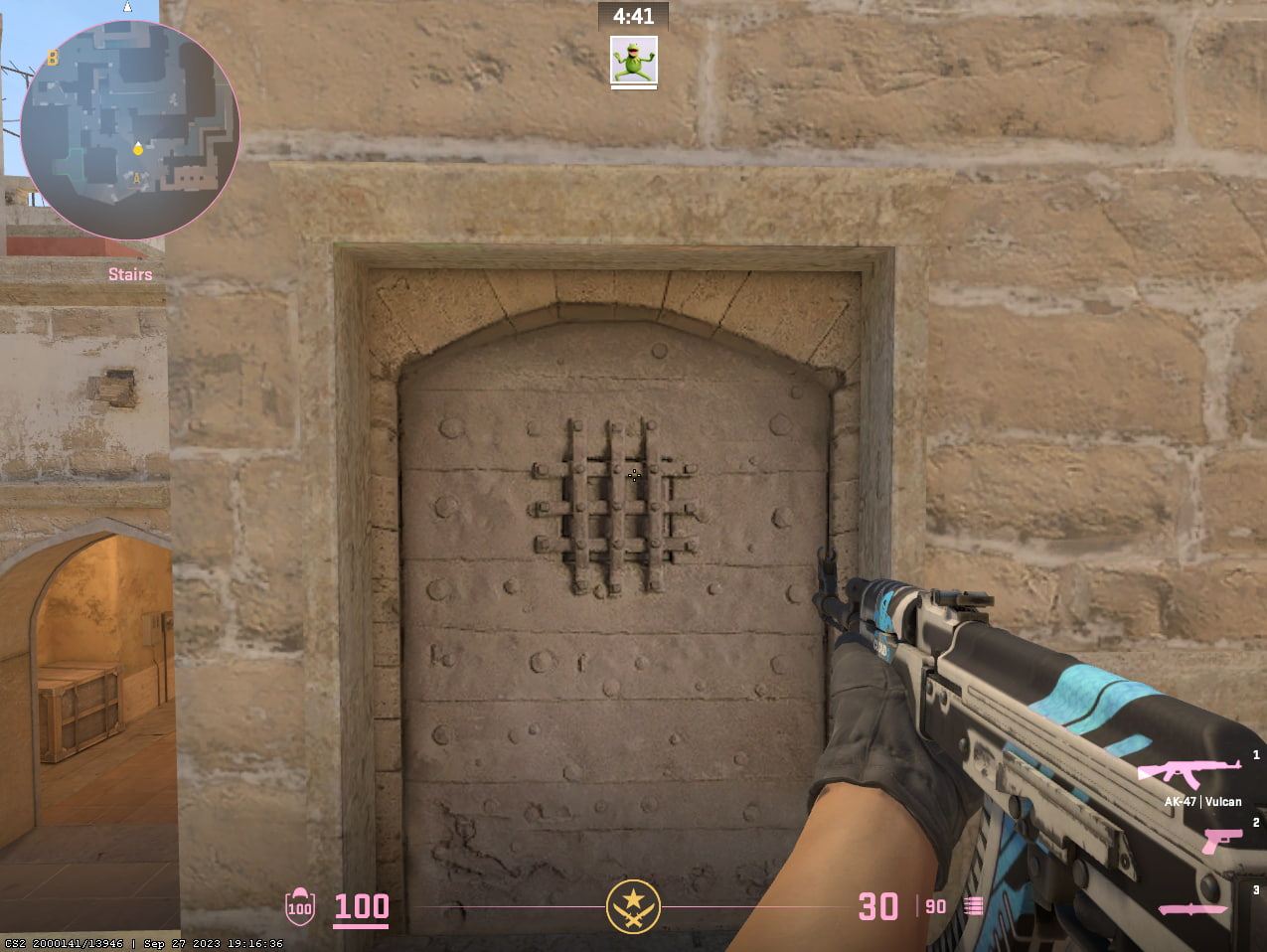 The couch viewmodel in CS2 on mirage with an ak47 pointed at a door