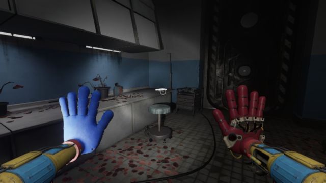 Looking at the tape on the table next to a submarine-style door at the end of Poppy Playtime Chapter 4