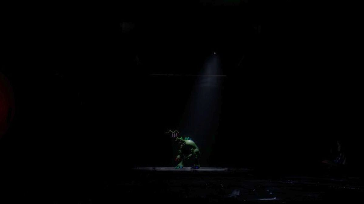 Pianosaurus standing in a dark room with a spotlight on him, looking at The Player from afar