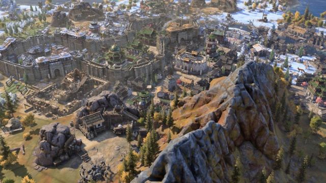 Mountains and a city in Civilization 7.