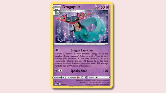 Dragapult Pokémon card on a pink background.