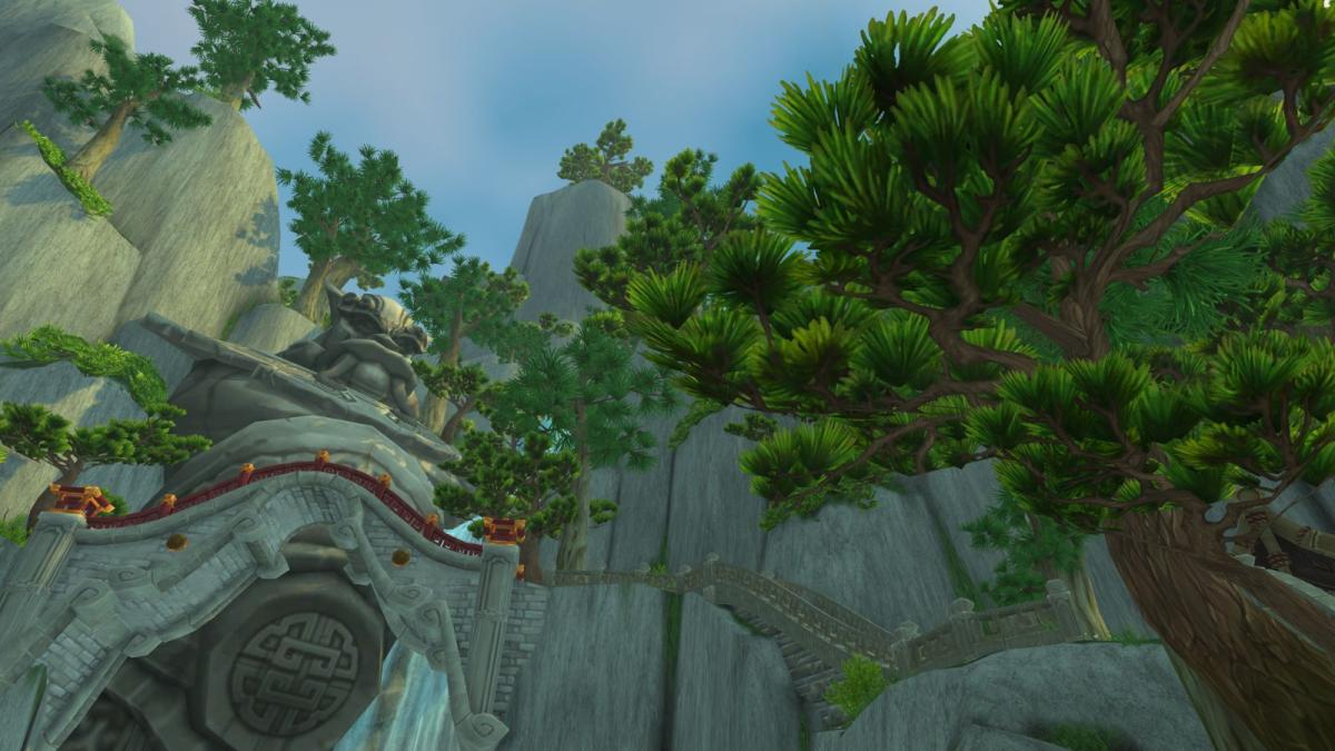 Jade Forest in World of Warcraft with trees and a giant statue.