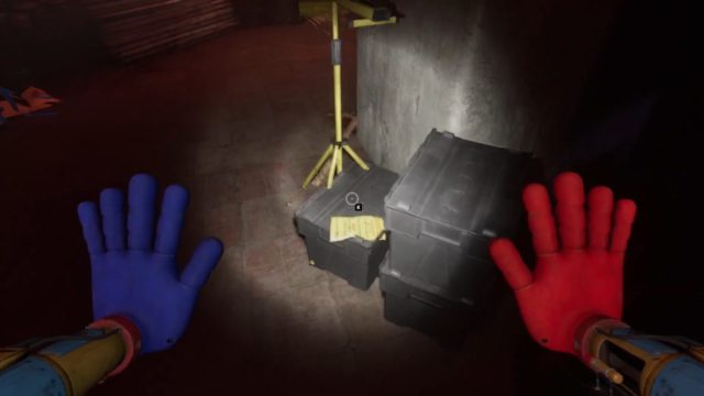 Looking at a note on top of a black container, near a small flood light/lamp, opposite a closed shutter