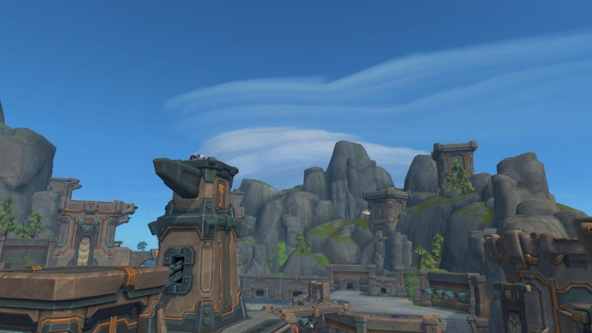 Screenshot of Dornogal in World of Warcraft with blue skies and large cliffs.