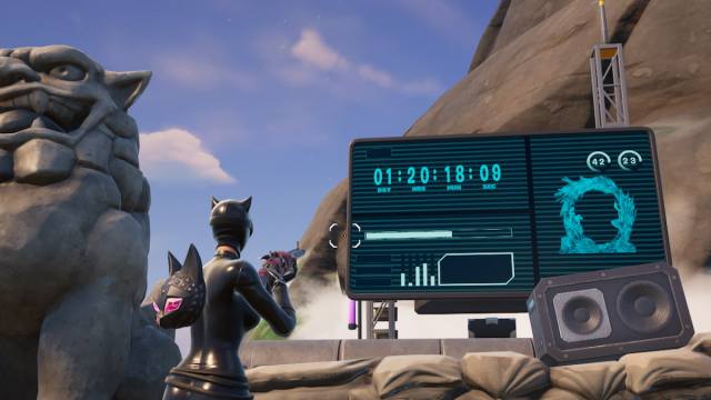 Catwoman looking at a timer countdown in Fortnite.