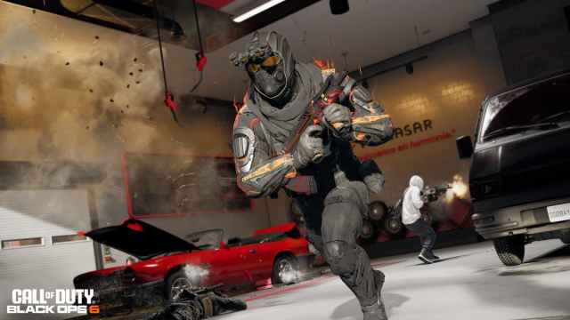 CoD operator running ina car dealership with a submachine gun in BO6 multiplayer