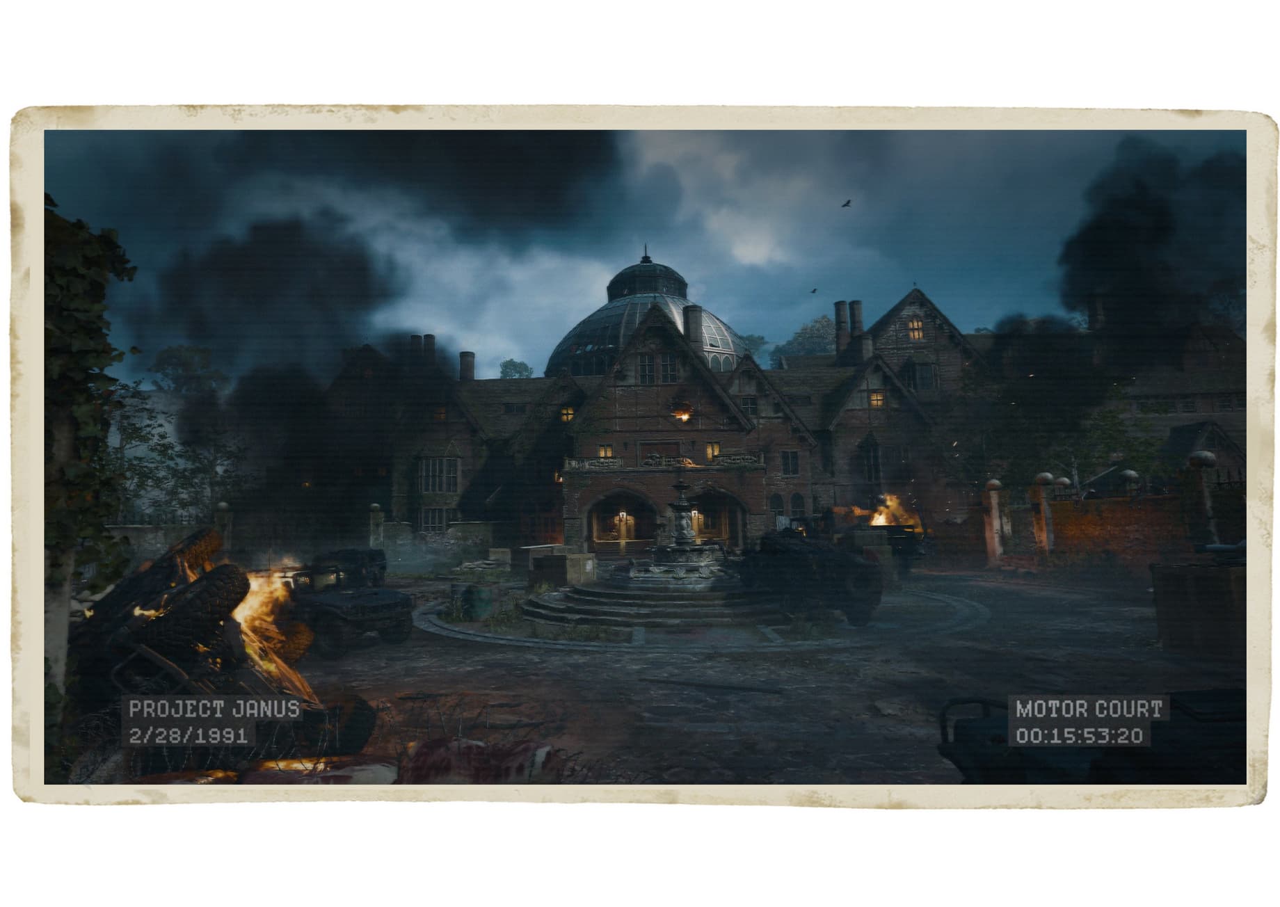 A dilapidated manor with piles of burning rubble in front of it against a smoky night sky.