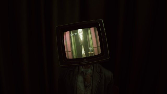 A shot of a severed Sean with a television head attached to his neck, showing a narrow corridor filled with doors on either side