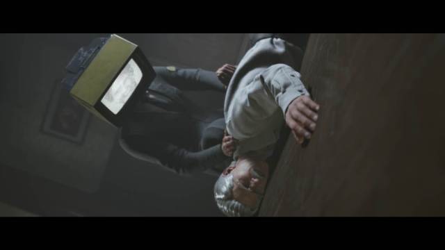 A unique shot of Professor McGovern having his body held down against the floor by a Leviathan employee