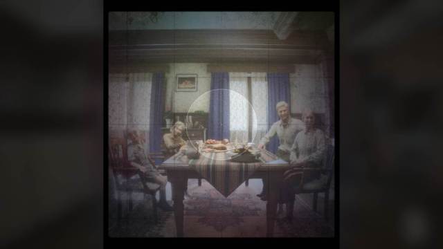 Taking a photo of family dinner using the old school camera in KARMA ending