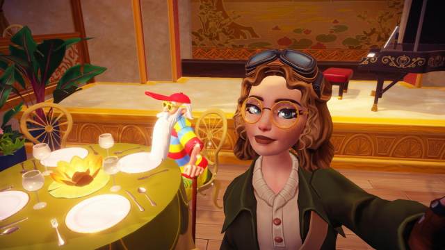 A player with gold glasses and short brown curly hair taking a picture with Merlin at a dining table in Disney Dreamlight Valley